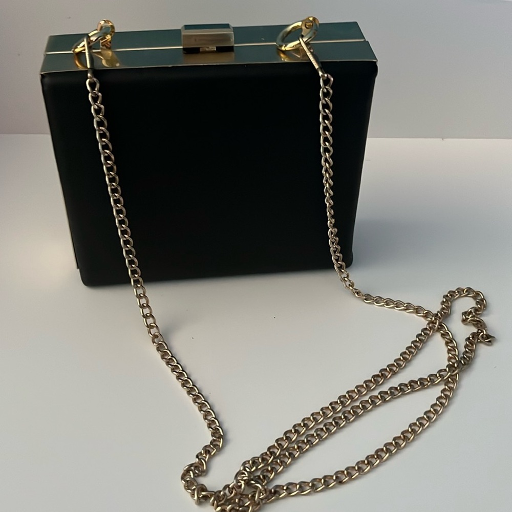 Black leather clutch bag